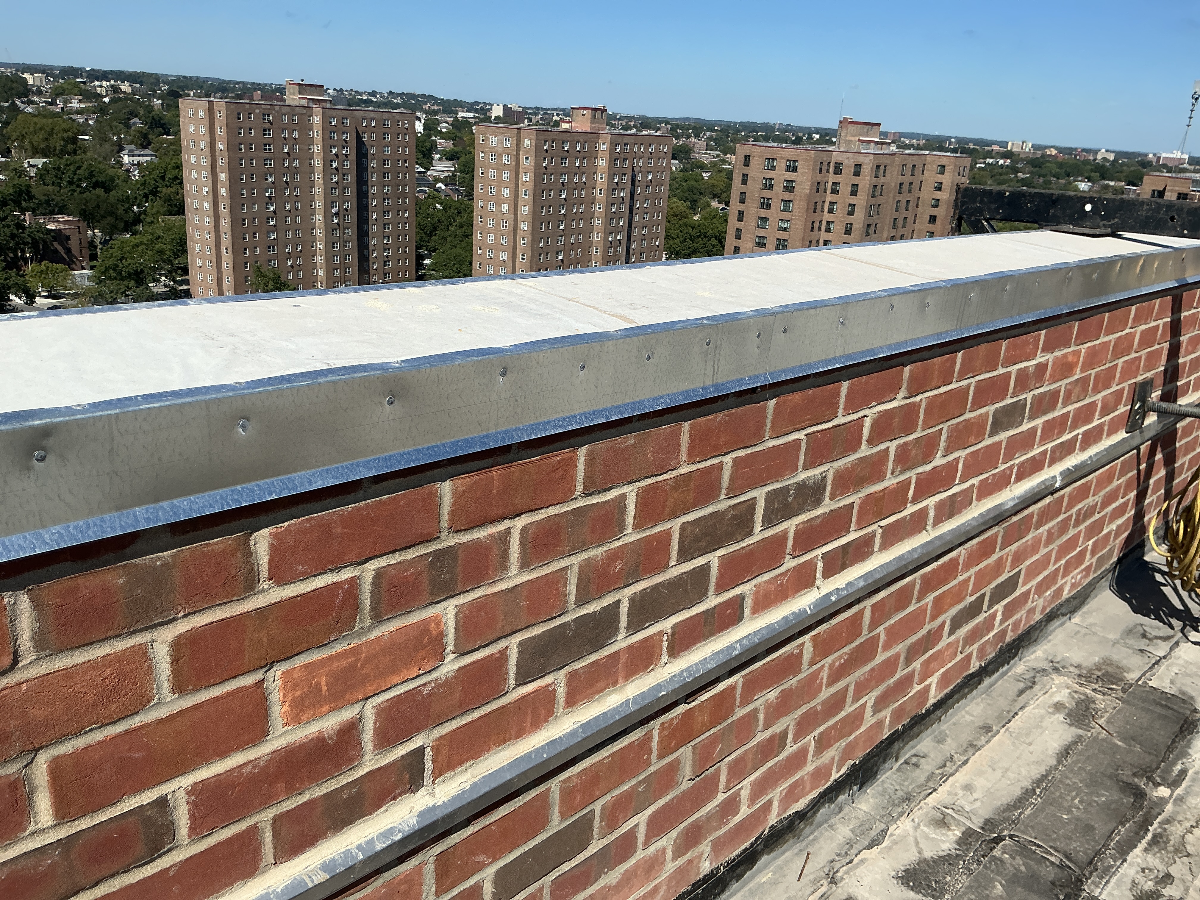 Parapet reconstruction with metal coping